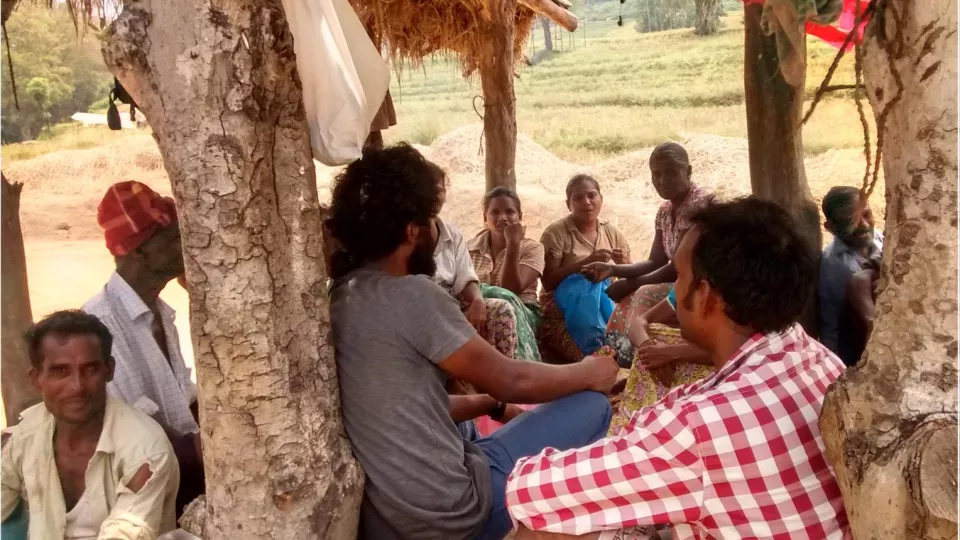 People sitting talking in Serupitiya village, Sri Lanka. Photo.